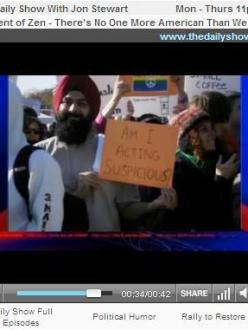 Sikh holds a sign at the Rally to Restore Sanity