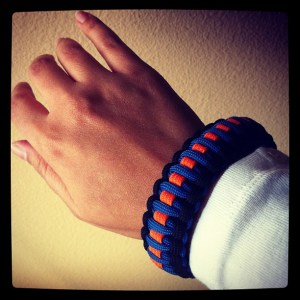 Woven bracelet that the Oak Creek Police Department had specially made for their officers to remember the shooting at the Oak Creek Gurdwara, including orange for the Sikh community, blue for the police officers, and black for those that were lost that day. (source: Sikh Coalition)