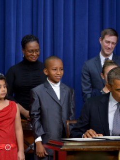 "President Obama signs gun-violence-related executive actions following an announcement at the White House Wedensday." (source: CNN)