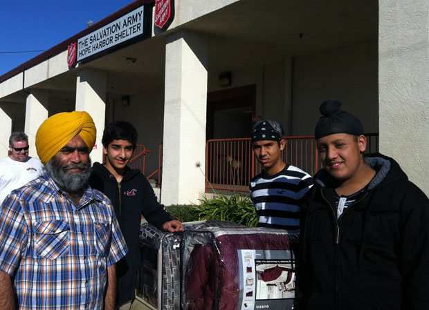 Sikhs in Lodi, California, donated 300 blankets on January 20 for the homeless. From left: Chiranjeev Singh Mangat, Paramveer Dhatt, Raunak Singh and Vikram Singh. (source: Lodi News-Sentinel)