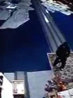 Surveillance video capture of men robbing the donation box at the Guru Nanak Sikh Temple in Livingston, California, early Sunday morning. (source: Merced Sun-Star)