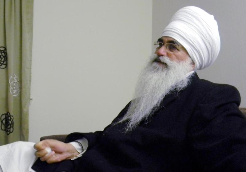 "In this March 2012 photo provided by his family, Punjab Singh poses at a Sikh temple in Glen Rock, N.J. Singh was critically injured in a shooting rampage at a Sikh temple in Oak Creek, Wis., in August 2012 that left six people dead. The 65-year-old Sikh priest had remained largely unresponsive at a Wisconsin care facility until January 2013 when he began showing signs of cognitive improvement." (AP Photo/Family photo)