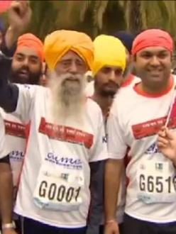 Fauja Singh finishes his last race in Hong Kong on Saturday. (source: CNN)