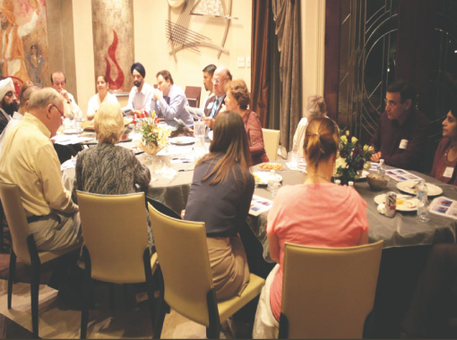 "Discussions over the dinner table at Bobby and Jasmeeta Singh’s home." (source: Indo American News)