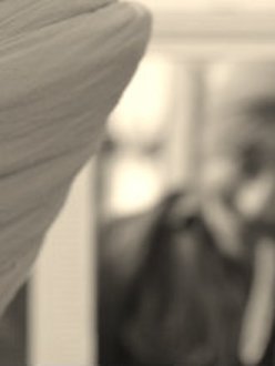 A young Sikh ties his turban in front of a mirror. (adapted photo from Turban King)