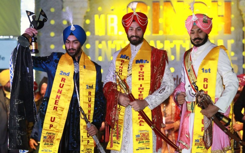 Tejinder Singh, the winner of the title of Mr Singh International 2012, poses with first runner-up Deepinder Singh (right) and second runner-up Tarundeep Singh (Picture: EPA/RAMINDER PAL SINGH/The Telegraph)