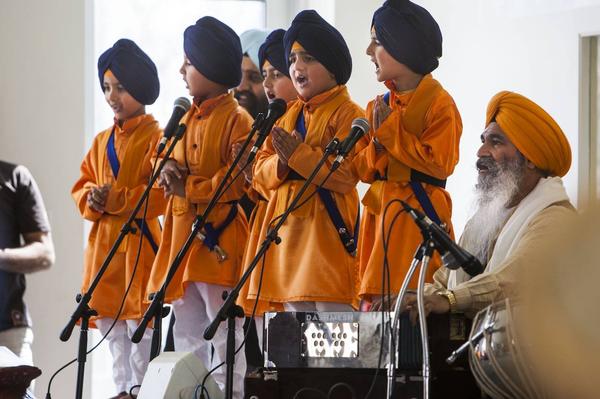 Five young Sikhs, representing the first five initiated members of the Khalsa in 1699, sing during Vaisakhi celebrations at the Sikh Temple of Utah yesterday. (source: Deseret News)