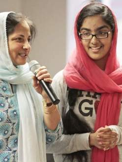 "Dr. Harminder Kaur and her daughter, Hana Mangat, 13, of Potomac, talk with children at the Guru Gobind Singh Foundation Sikh temple about a movie they made to educate people about Sikhism. The first viewing of the film was held Sunday in Rockville." (credit: Bill Ryan/Maryland Gazette)