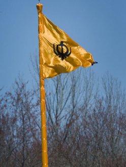 "A flag waves in the wind atop a flagpole wrapped in orange material outside the Sikh Sabha of New Jersey, located in Lawrenceville, New Jersey, in celebration of Vaisakhi" (source: Michael Mancuso/The Times of Trenton)