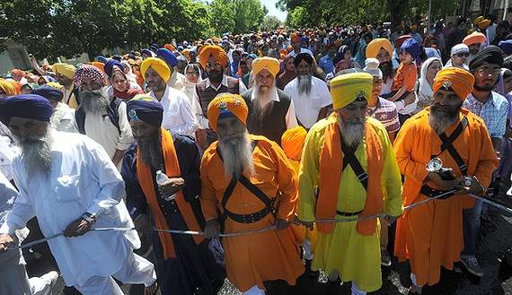 "Participants celebrate the 15th annual Sikh parade as they walk along South San Joaquin Street in Stockton." (Photo: Michael McCollum/The Record)