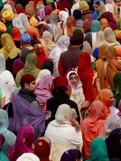 "Thousands walk in Renton’s Khalsa Day parade. Sikh men, and some women, wear turbans as one of five external articles of faith called the five Kakars. Women also wear long headscarves called dupattas at religious ceremonies to show respect." (source: Erika Schultz)