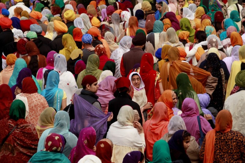 "Thousands walk in Renton’s Khalsa Day parade. Sikh men, and some women, wear turbans as one of five external articles of faith called the five Kakars. Women also wear long headscarves called dupattas at religious ceremonies to show respect." (source: Erika Schultz)