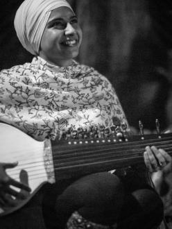 A Sikh woman with a rabab, a traditional Sikh instrument. (Photo credit: Karaminder Ghuman)