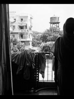 "A witness of the 1984 pogrom. More than 10 members of her family were killed before her eyes. She testified in a court that the Congress leader Jagdish Tytler was present at the site of the killings in 1984. Her lawyer was shot at in the very first hearing. She withdrew the case. The aftermath of the violence has left her numb." (Credit: Gauri Gill | The New York Times)