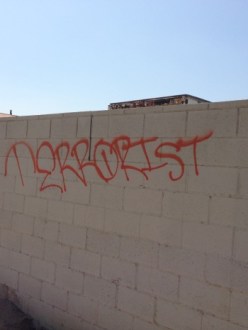 "Terrorist" spray-painted on a wall at the Sikh Gurdwara of Riverside, in Jurupa Valley, California. (Source: PEBloggers)