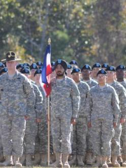 "Spc. Simranpreet Lamba carries the guidon for his platoon in Company A, 3rd Battalion, 34th Infantry Regiment, during the battalion's Basic Combat Training graduation Wednesday morning." (Source: US Army)