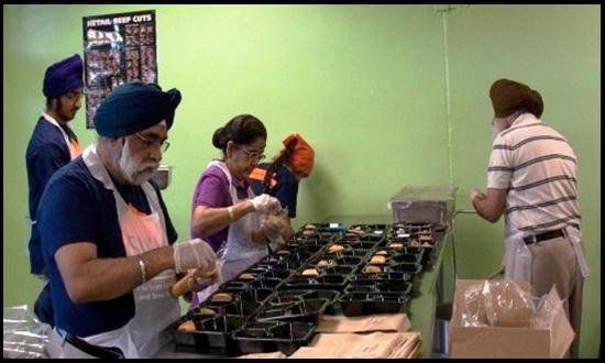 "GP Singh (left, foreground) volunteering with fellow Sikhs at the San Antonio Food Bank." (Source: San Antonio Express-News)