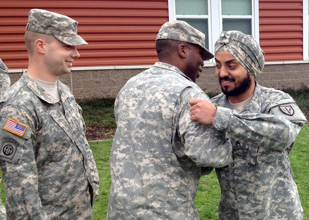 "Cpl. Simranpreet Lamba receives congratulations at his promotion ceremony on Joint Base Lewis-McChord Friday, Sept. 27. 2013." (Photo: Adam Ashton | News-Tribune)
