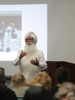 "Santokh Singh Sahi speaks with guest during a meet-greet with members of the Sikh community, on Tuesday, Sept. 10, 2013 at the Glen Avon Library. " (Credit: STAN LIM/Press-Enterprise)