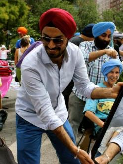 "Sharing a laugh at Turban Day in New York City." (Source: Huffington Post)