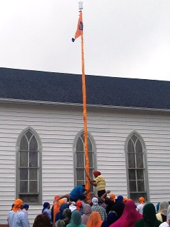 On Sunday, Sikhs in Indiana raised the Nishan Sahib at the Sikh Gurdwara of Fort Wayne, in Roanoke, Indiana. (Source: Lori Way)