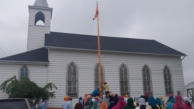 On Sunday, Sikhs in Indiana raised the Nishan Sahib at the Sikh Gurdwara of Fort Wayne, in Roanoke, Indiana. (Source: Lori Way) 