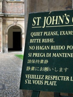 A sign displayed outside a college provides instructions in several languages. (Source: The Economist)