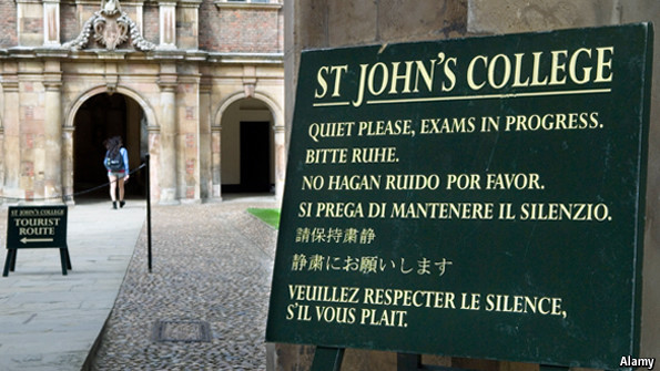 A sign displayed outside a college provides instructions in several languages. (Source: The Economist)