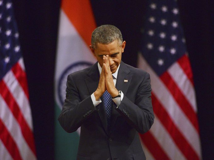 "President Obama delivers a traditional Indian greeting before he speaks on Jan. 27 in New Delhi, India. The president, who was guest of honor at India's Republic Day celebrations, wrapped up his visit by talking about the freedom to practice one's religion, the rights of women and the need to provide every child with equal opportunity." (Photo: European Pressphoto Agency. Source: USA Today.).
