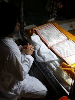Reading from the Guru Granth Sahib at the Sikh Gurdwara of Fort Wayne in Fort Wayne, IN. Photo credit: Nicole Johnson Smith